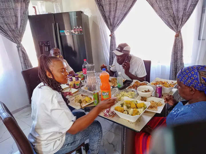Photo of a family eating lunch around a kitchen table
